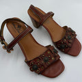 Patricia Nash brown Italian leather floral studded sandals for women, size 9.5, featuring decorative floral and studded details.