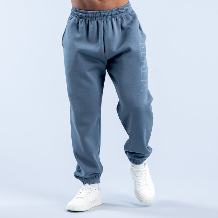 Blue graphic jogger pants with elastic waistband, tapered cuffs, and side print