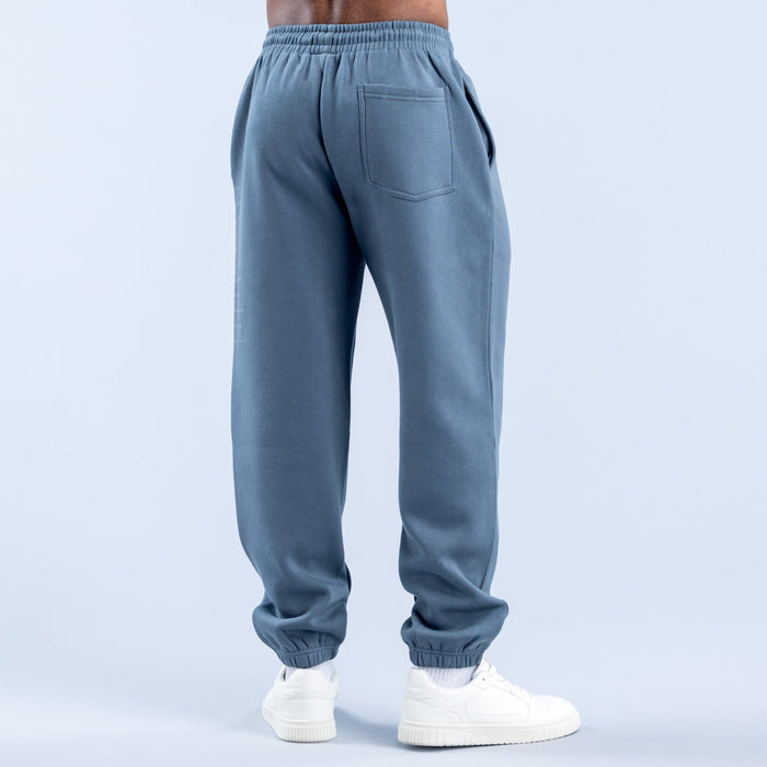 Blue jogger pants with elastic waistband and back pocket detail, cuffed hems