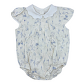 Baby romper with floral pattern and white collar on a white background