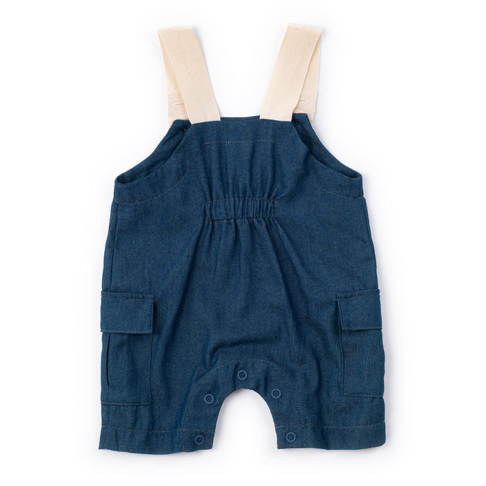 Blue denim baby romper with beige straps on a white background