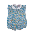 Floral baby romper with a white collar on a white background
