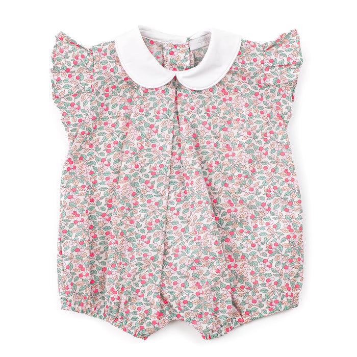 Floral baby romper with a white collar on a white background