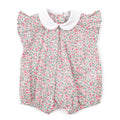 Floral baby romper with a white collar on a white background