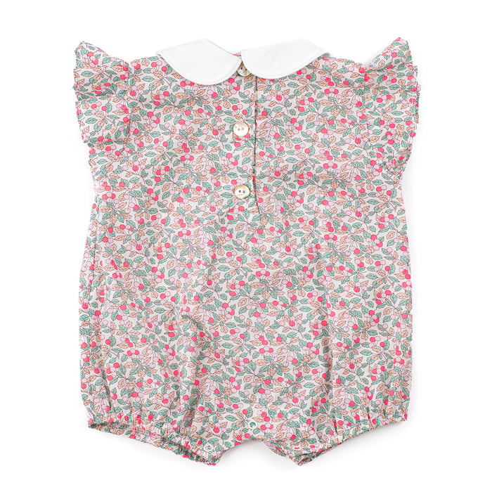 Floral baby romper with a white collar on a white background