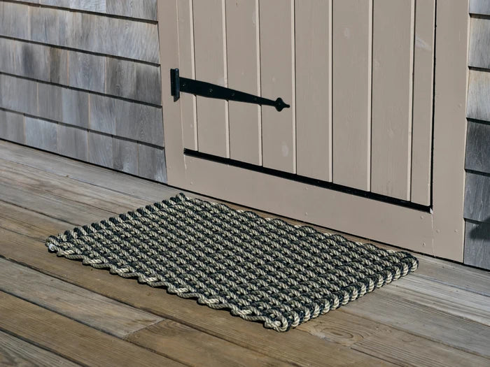 Charcoal and sand rope doormat, diamond-textured weave, rectangular.