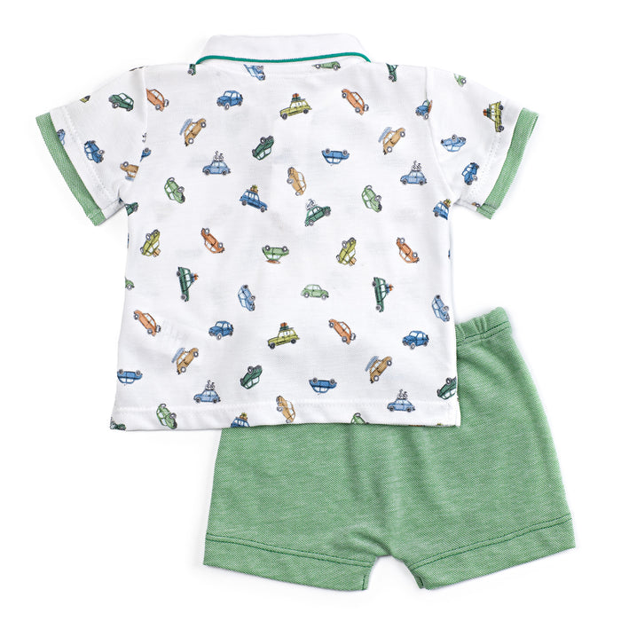 Children's outfit with a white shirt featuring car patterns and green shorts on a white background