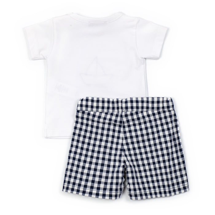 White t-shirt and black and white checkered shorts on a white background
