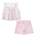 Children's outfit with pink floral top and shorts on a white background