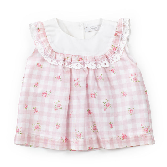 Pink checkered dress with floral patterns on a white background