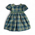 Green plaid dress with short sleeves on a white background