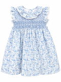 Blue floral dress with white ruffled collar on a white background