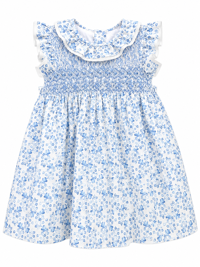 Blue floral dress with white ruffled collar on a white background