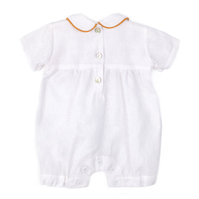 White baby romper with orange trim on a white background