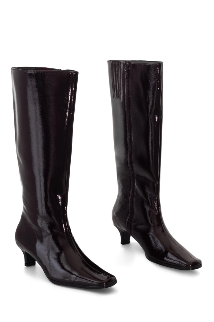 A pair of knee-high patent leather boots in a very dark brown or near-black color, shown from the side against a plain white background.