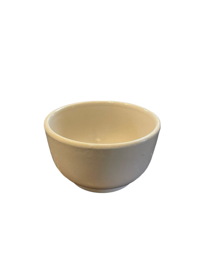 Beige stoneware bowl with smooth rounded sides and wide open rim