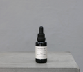 Fragrance refill oil bottle with black dropper, label 'Eos'.