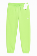Jordan Ghost Green sweatpants for kids, size 12–13, with elastic waistband and Jordan logo detail visible.