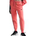 Women's Nike Tech Fleece Jogger Pants in mid-rise fit, medium size, featuring a comfortable, tapered design and Nike branding.