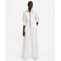 Nike Tech Fleece Windrunner jumpsuit in grey, front view showing the sleek design and full-length zipper.
