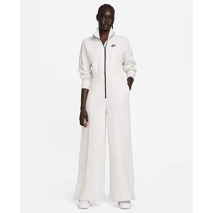 Nike Tech Fleece Windrunner jumpsuit in grey, front view showing the sleek design and full-length zipper.