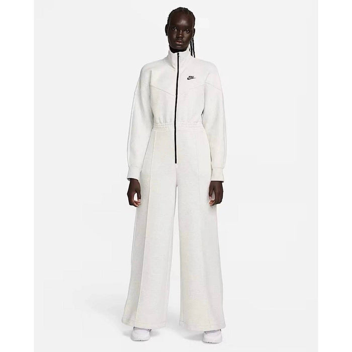 Nike Tech Fleece Windrunner jumpsuit in grey, showing the full front view with Nike logo and zip-up design.