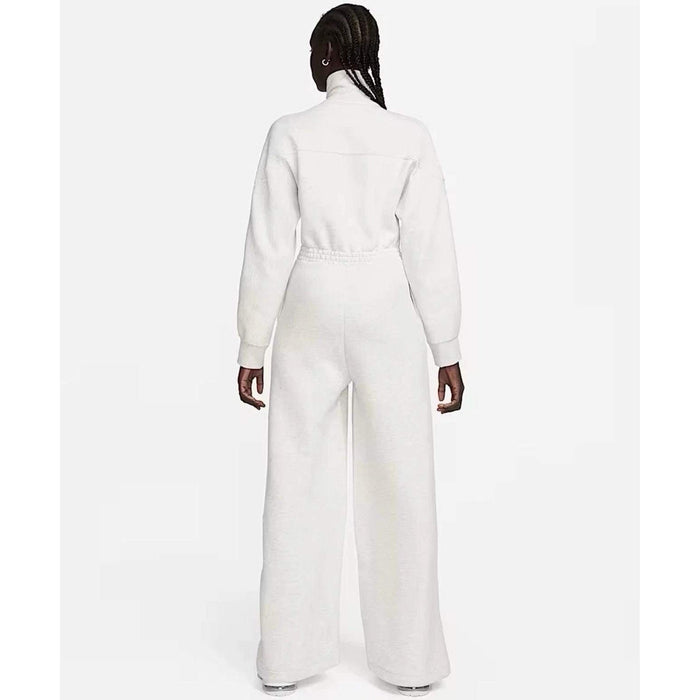 Nike Tech Fleece Windrunner jumpsuit in grey, showing front view with hood, zipper, and athletic fit.