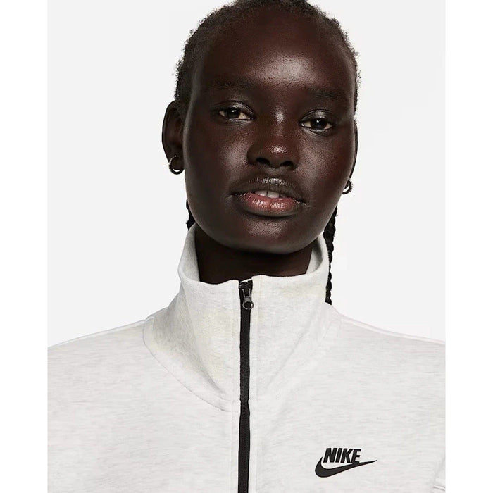 Nike Tech Fleece Windrunner jumpsuit in grey, front view showing the Nike logo and sleek, fitted design.