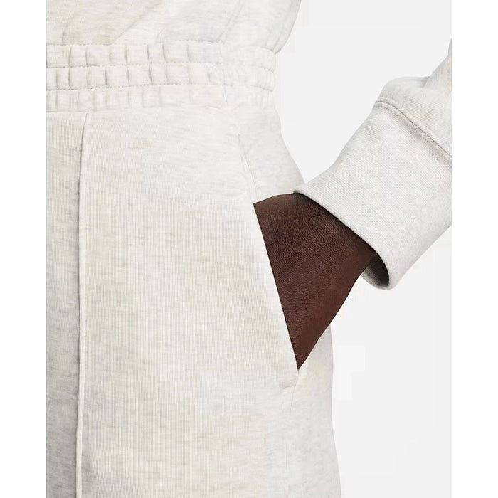 Nike Tech Fleece Windrunner jumpsuit in grey, featuring a sleek design and athletic fit, perfect for active wear.
