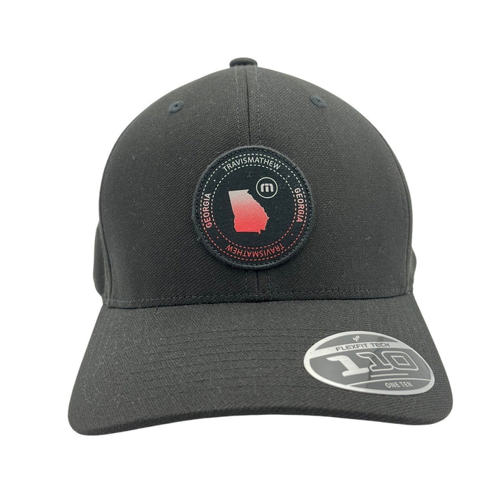 TravisMathew Georgia FlexFit Tech 110 golf cap, navy blue hat with curved brim and embroidered logo, designed for performance and comfort
