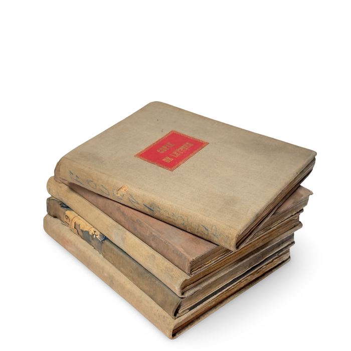 Vintage book set with beige covers and red label, stacked with visible spine edges.