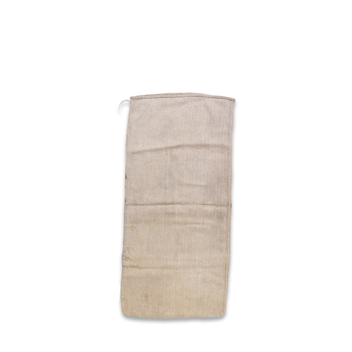 Vintage grain sack in light tan with frayed edges and top loop handle