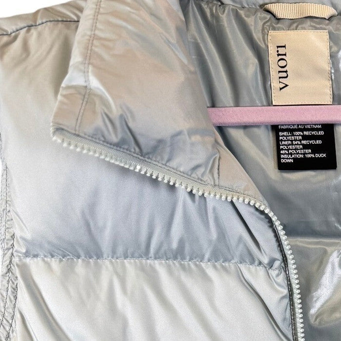 Vuori Women's Hillside Down Vest with 100% duck down insulation, lightweight and puffy, in a neutral color, front view.