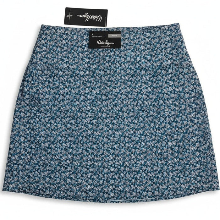 Walter Hagen P11 Sculpt Skort 17-inch in Dogwood Ditsy pattern worn by a woman, showcasing lightweight athletic women's skort.