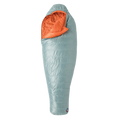 The Big Agnes Returns Women's Greystone 30° sleeping bag in light blue, featuring DownTek insulation, stands upright against a white background. Its mummy-style hood is slightly open, showing the bright orange interior lining.